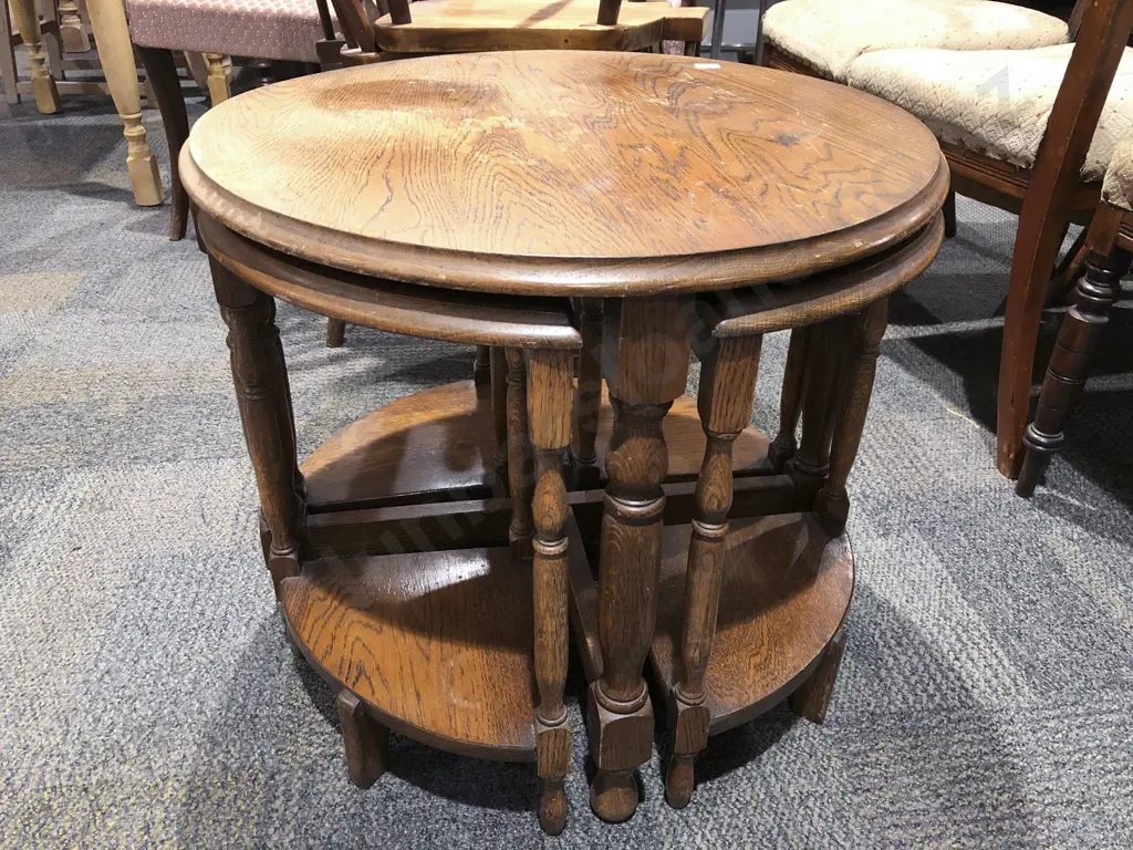 Circular Oak Coffee Table with Four Nesting Stools Image 1++