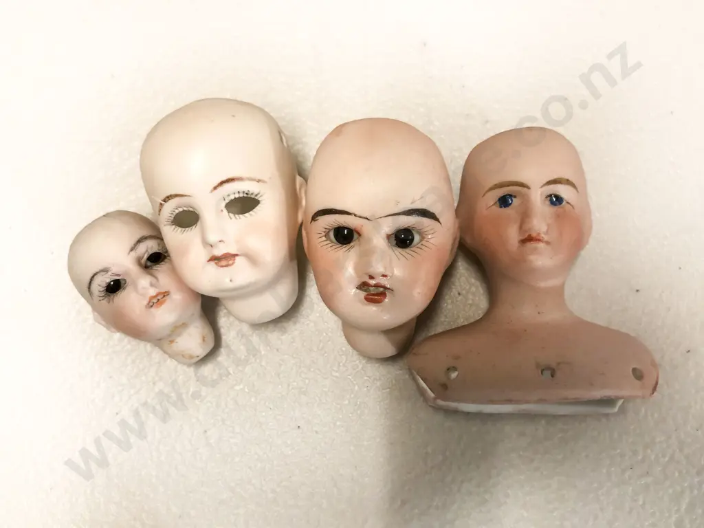 Two French Bisque and Two Other Doll Heads Image 1++