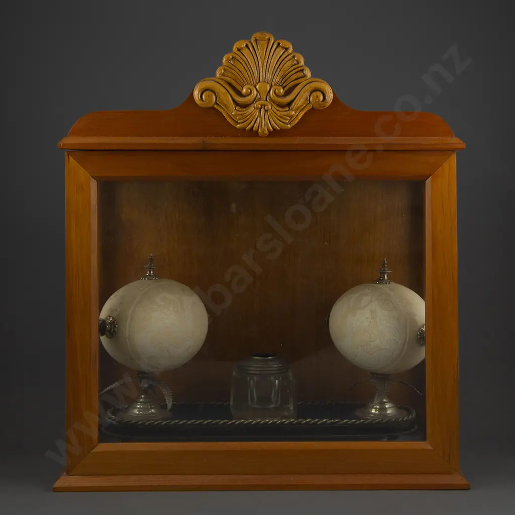 A Pair Of Australian Carved Ostrich Eggs Displayed In A Glazed Case Image 1++