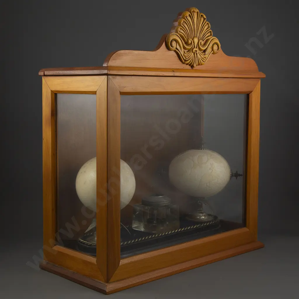 A Pair Of Australian Carved Ostrich Eggs Displayed In A Glazed Case Image 1++
