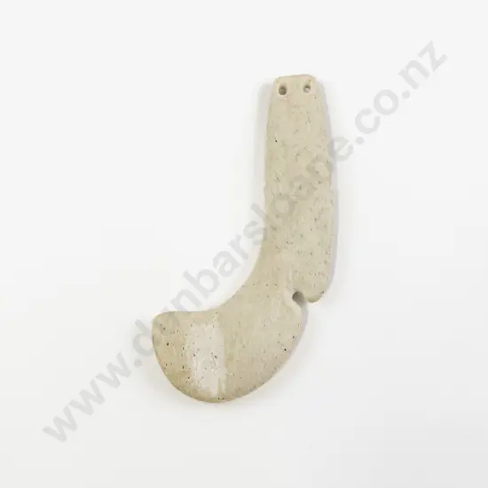 A Carved Whalebone Matau Shaped Pendant