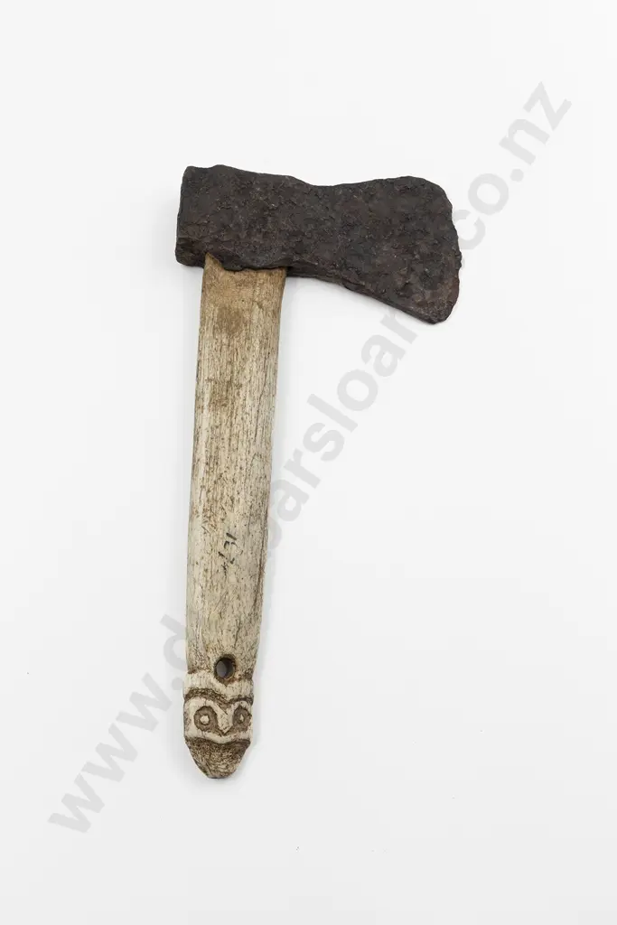 A Whalebone Patiti With A Trade Axe Head Image 1++