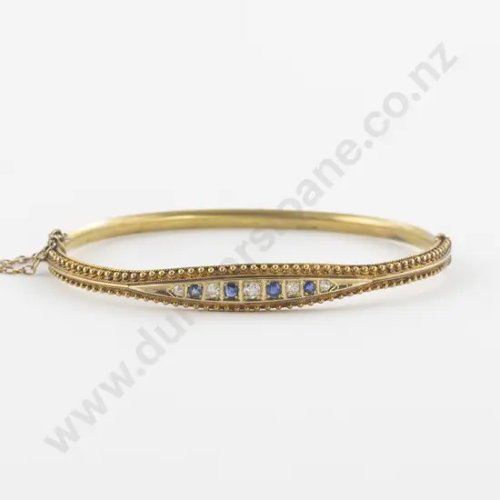 Late Victorian 15ct Nine Stone Diamond and Sapphire Hinged Snap Bangle