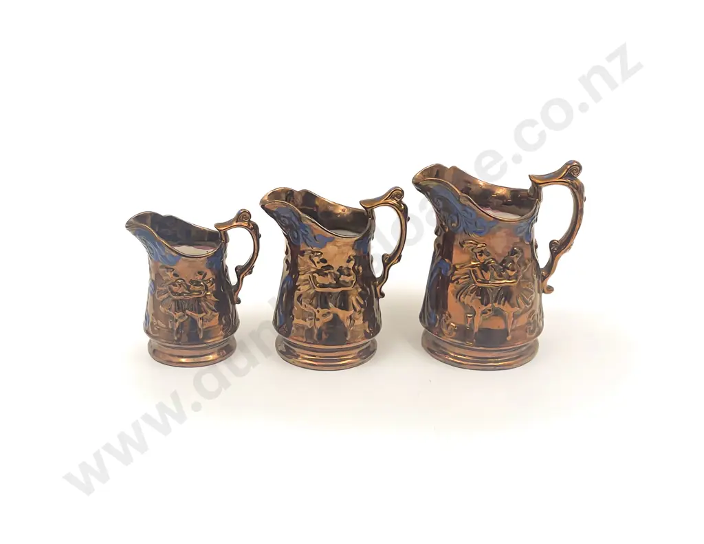 Graduated Set of Three Copper Lustre Jugs Image 1++