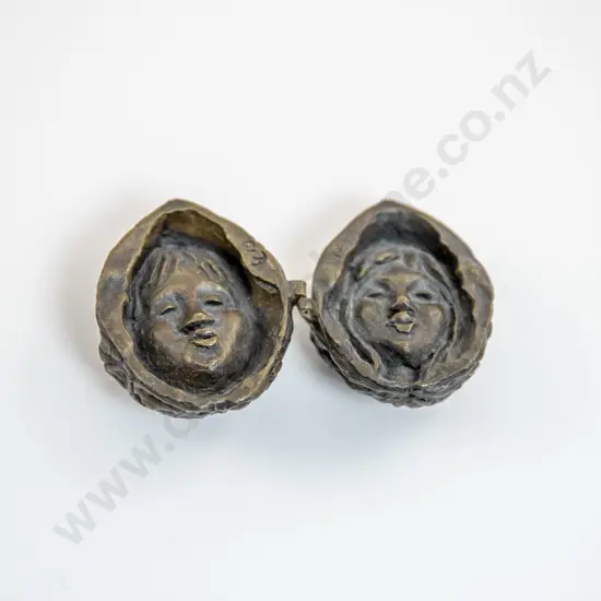 Small Hinged Bronze Walnut With Two Faces To The Interior