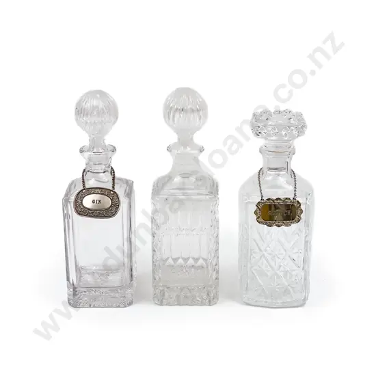 Three Assorted Glass Decanters