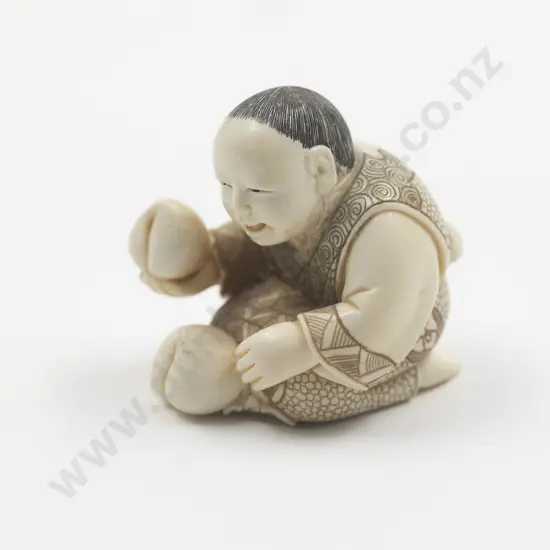 Japanese Ivory Netsuke Of A Boy Holding A Peach