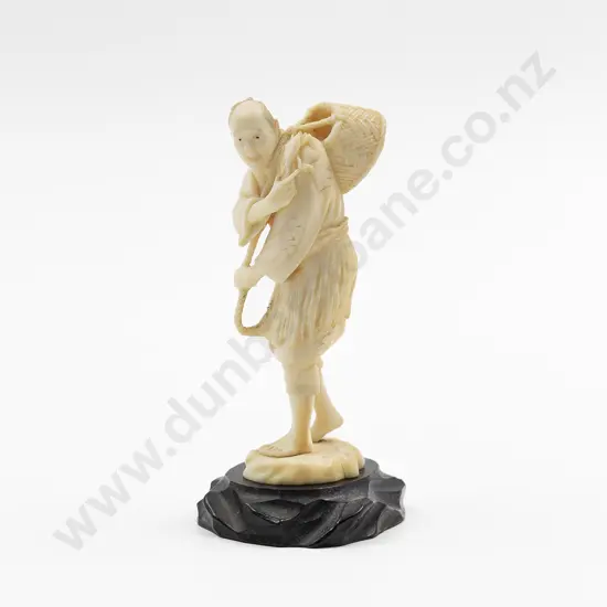 Signed Ivory Figure of Standing Fisherman