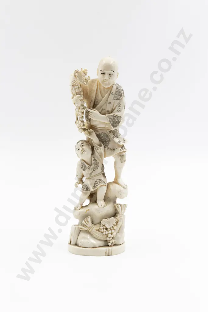 Japanese Signed Carved Ivory Figure of a Standing Man Gathering Grapes Image 1++