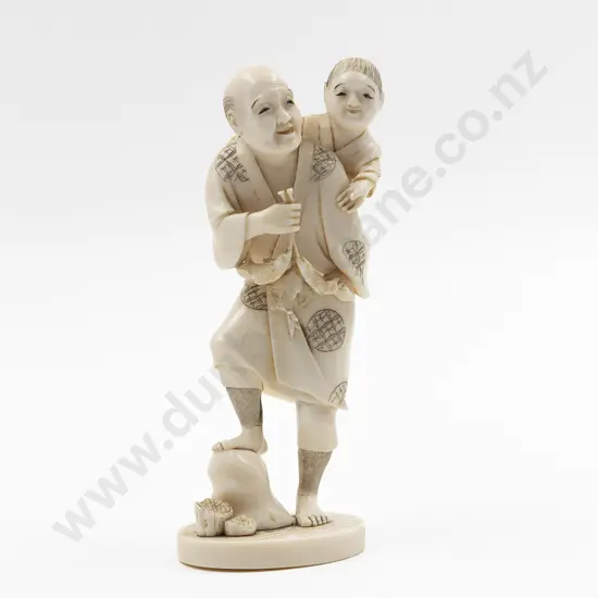 Signed Carved Ivory Figure of a Fisherman