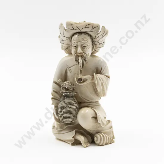 Chinese Carved Ivory Figure of Seated Trader