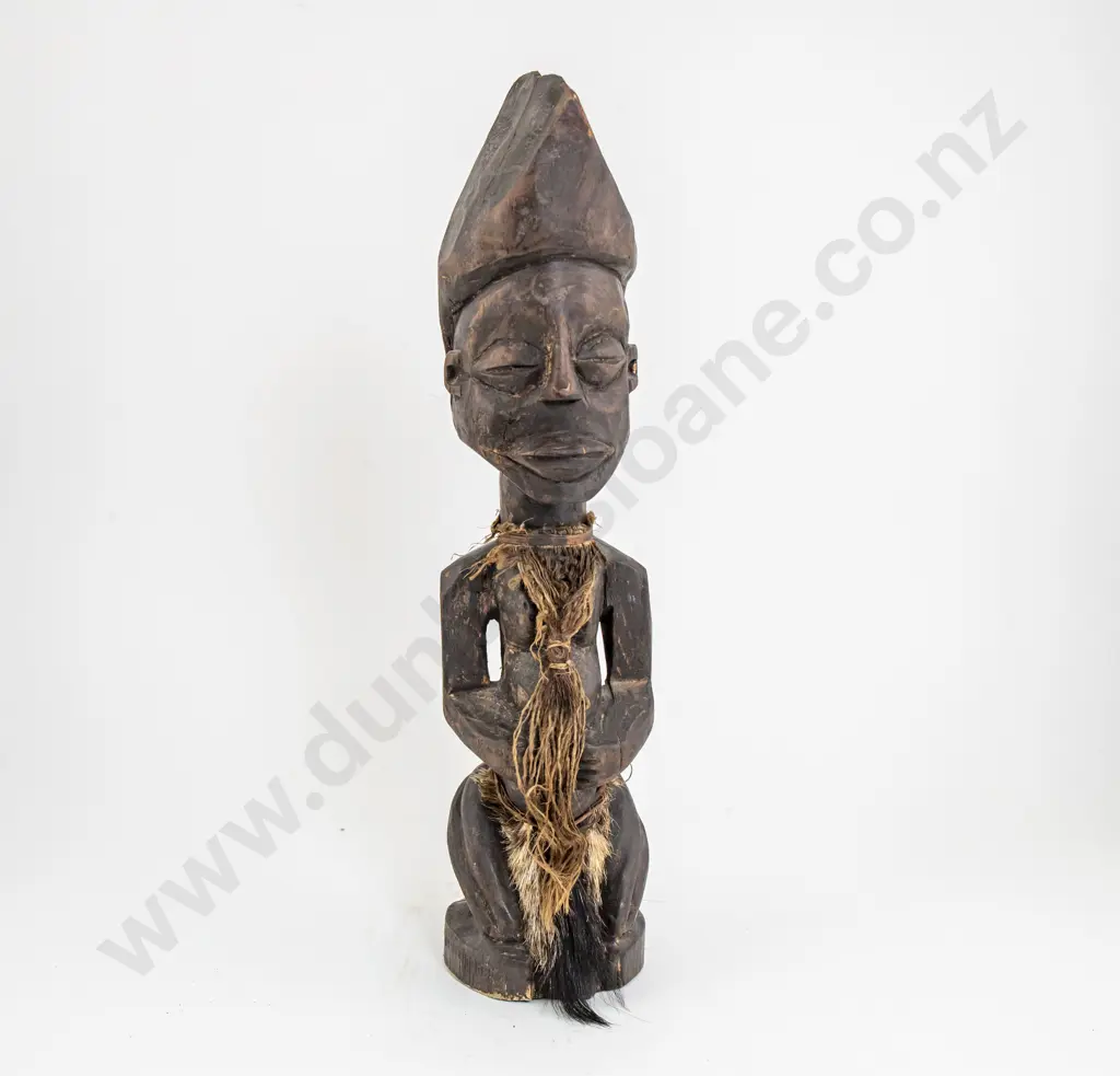 A Decorative African Sitting Figure Image 1++