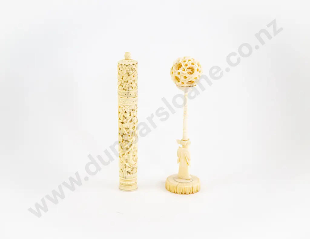 An Ivory Puzzle Ball On A Stand And An Ivory Game Image 1++