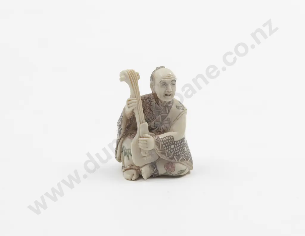 Signed and Coloured Pattern Ivory Netsuke of Musician playing a Shamisen Image 1++
