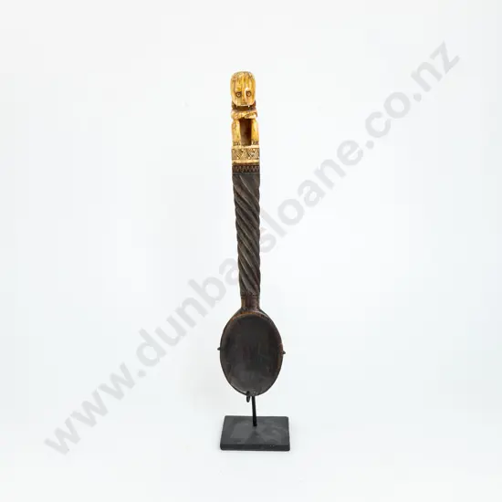 An Indonesian Carved Wood Spoon With An Ivory Finial