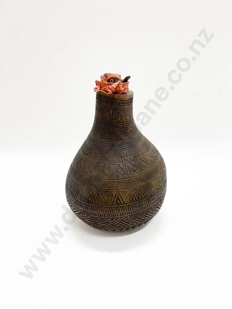 A Large Gourd With Incised Decoration And An African Doll Image 1++