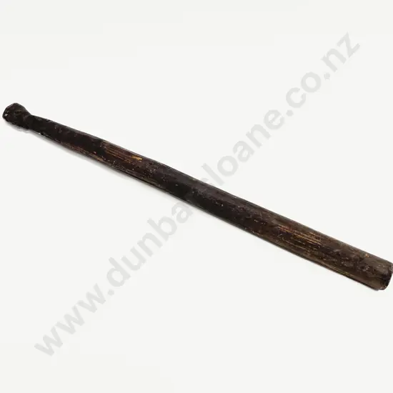 A Carved Wood Sago Pounder