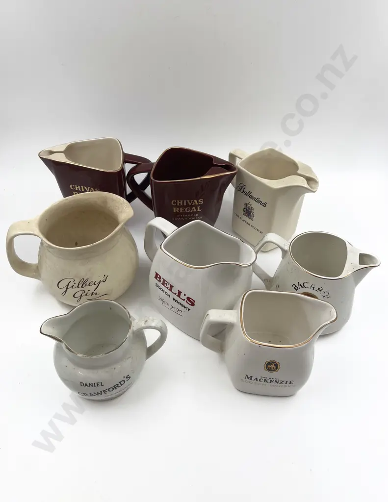 Eight Assorted Whisky Advertising Jugs Image 1++