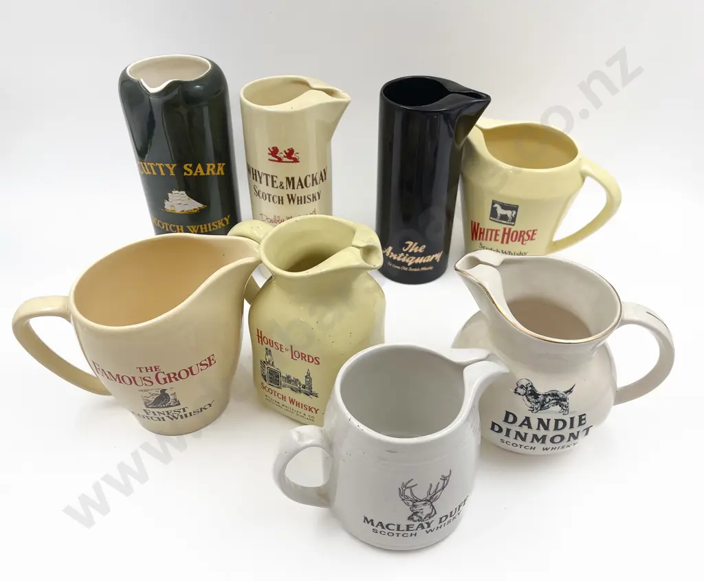 Eight Assorted Whisky Advertising Jugs Image 1++