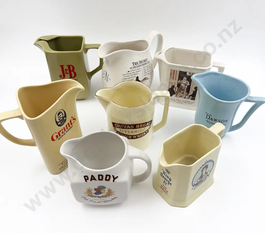 Eight Assorted Whisky Advertising Jugs Image 1++