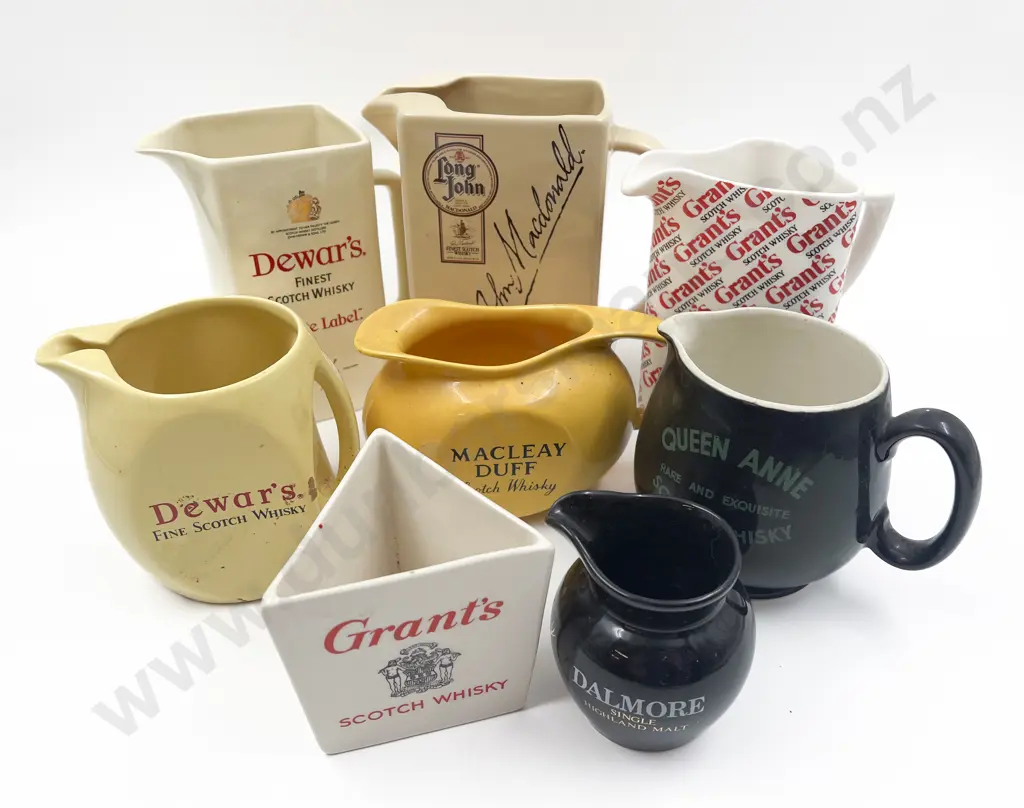 Eight Assorted Whisky Advertising Jugs Image 1++