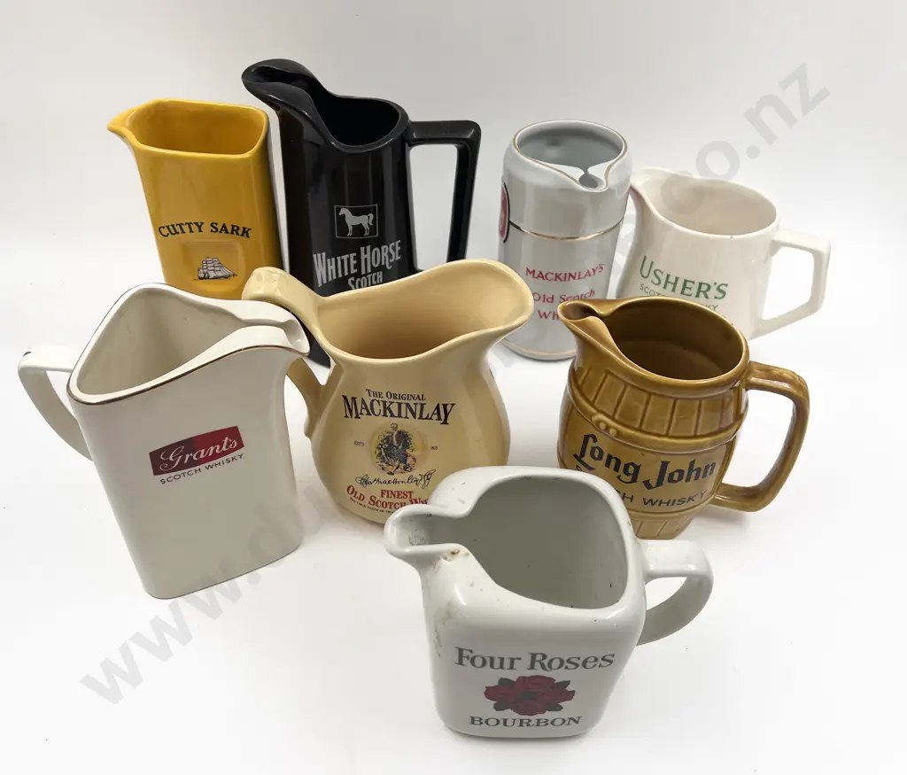 Eight Assorted Whisky Advertising Jugs Image 1++