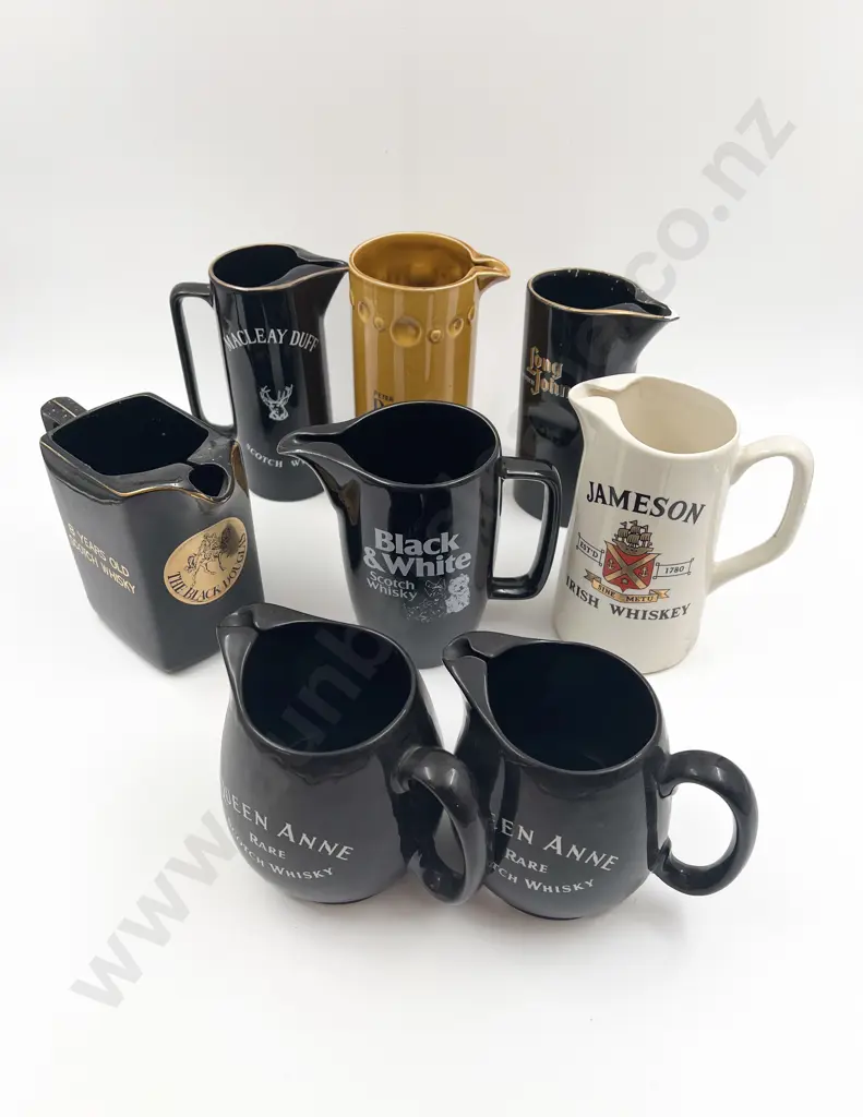 Eight Assorted Whisky Advertising Jugs Image 1++