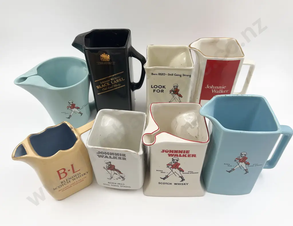 Eight Assorted Whisky Advertising Jugs Image 1++