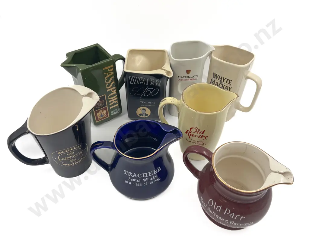 Eight Assorted Whisky Advertising Jugs Image 1++