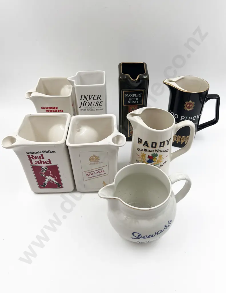 Eight Assorted Whisky Advertising Jugs Image 1++