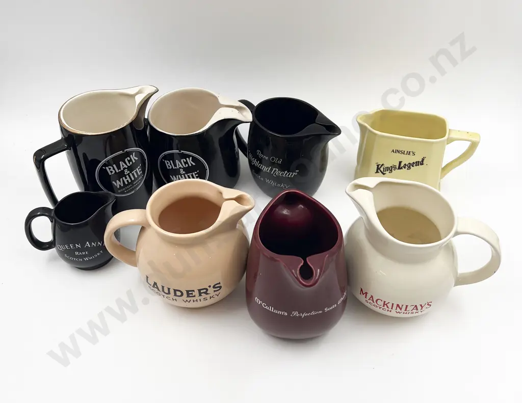 Eight Assorted Whisky Advertising Jugs Image 1++