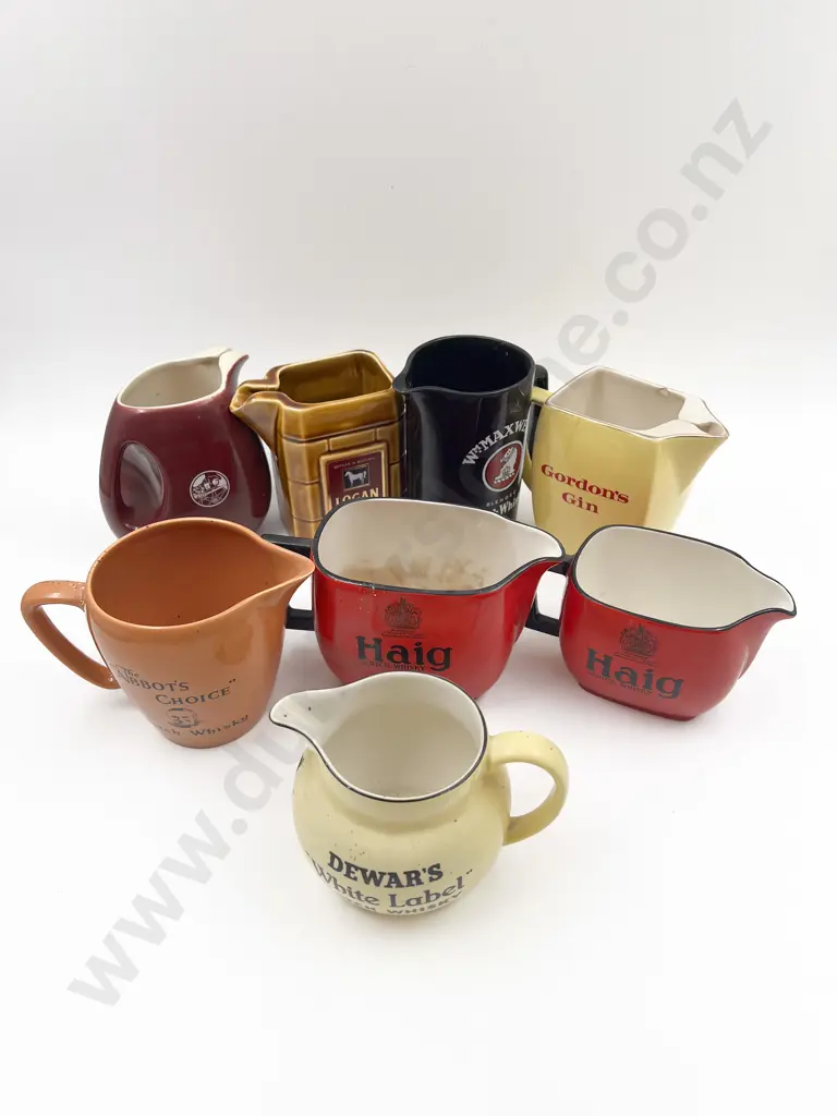 Eight Assorted Whisky Advertising Jugs Image 1++