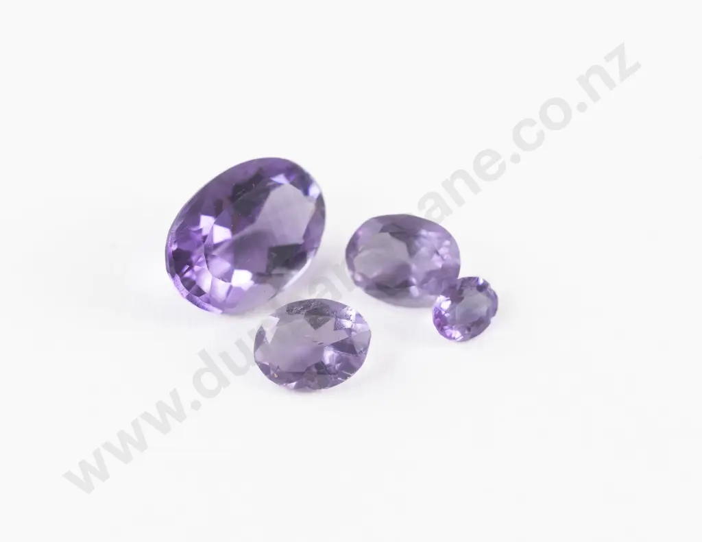 Four Unmounted Amethyst Stones Image 1++