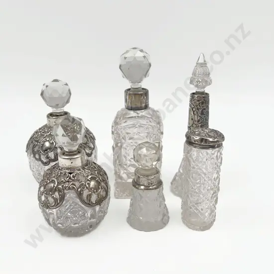 Five Silver Collared Scent Bottles together with S/S Topped Vanity Jar