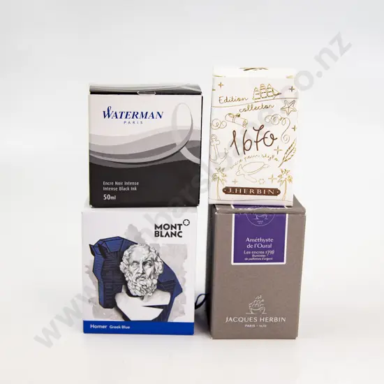 Four Various Bottles of Ink and Desk Pad