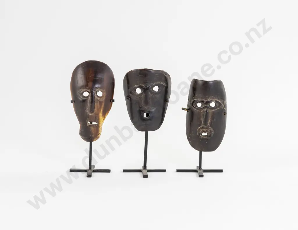 Three Small African Masks on Stands Image 1++