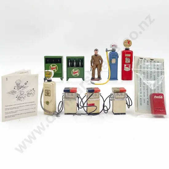 Vintage Britians and Crescent Metal Petrol Pumps Oil Stands and Attendant set three plastic pumps
