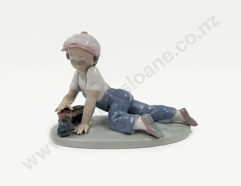 Lladro Figure of a Young Boy with Train Image 1++