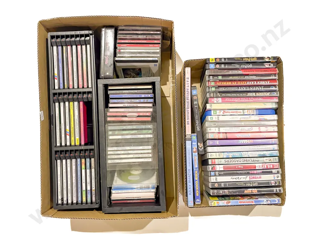 Four Boxes of Assorted CDs and DVDs Image 1++