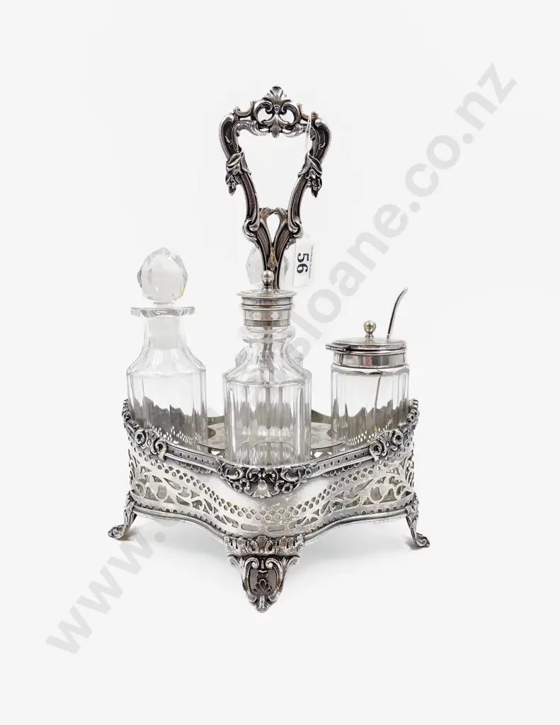 Vict S/P 4 Bottle Cruet Stand of quatrefoil outline with fixed scroll handle Image 1++