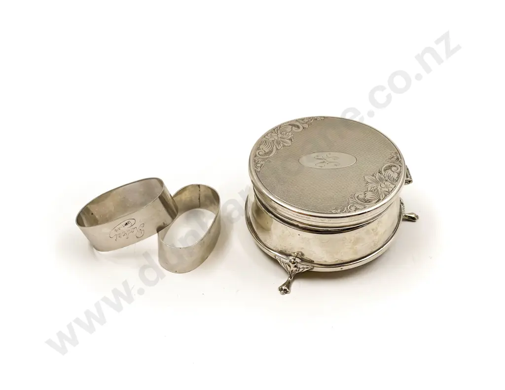 S/S Circular Jewellery Box together with Two S/S Napkin Rings Image 1++