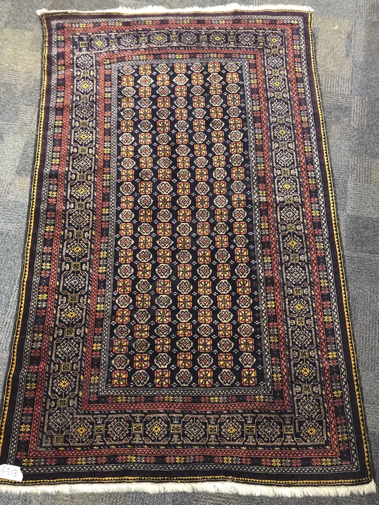 Afghani Woollen Floor Rug with Multiple Borders on a Dark Navy Ground Image 1++