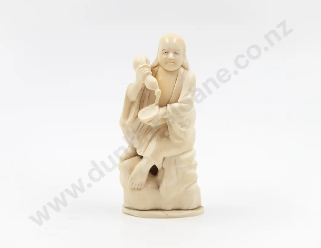 Signed Carved Ivory Figure of A Immortal Seated on Craggy Rock Image 1++