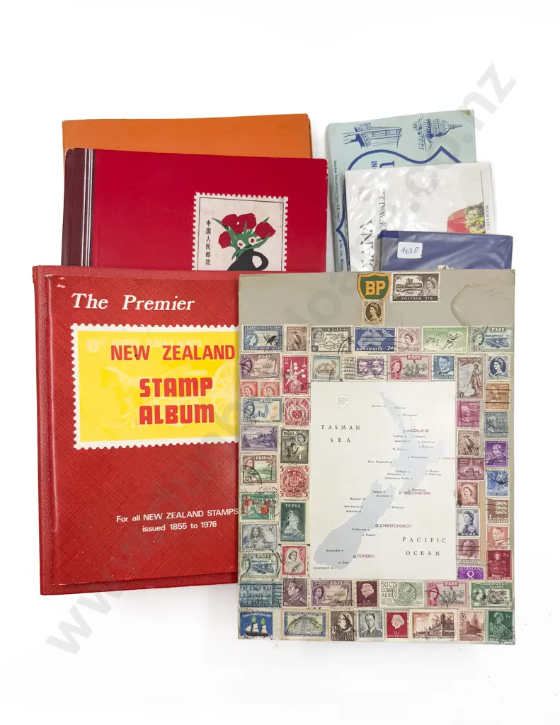 Four Stamp Albums and Assorted Stamps Image 1++