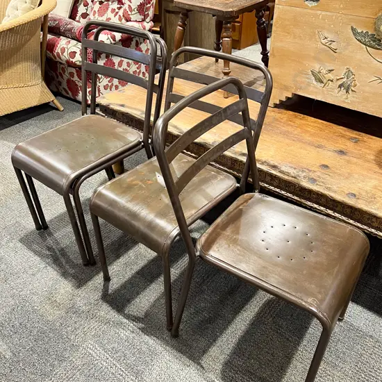 Four Industrial Style Stacking Chairs