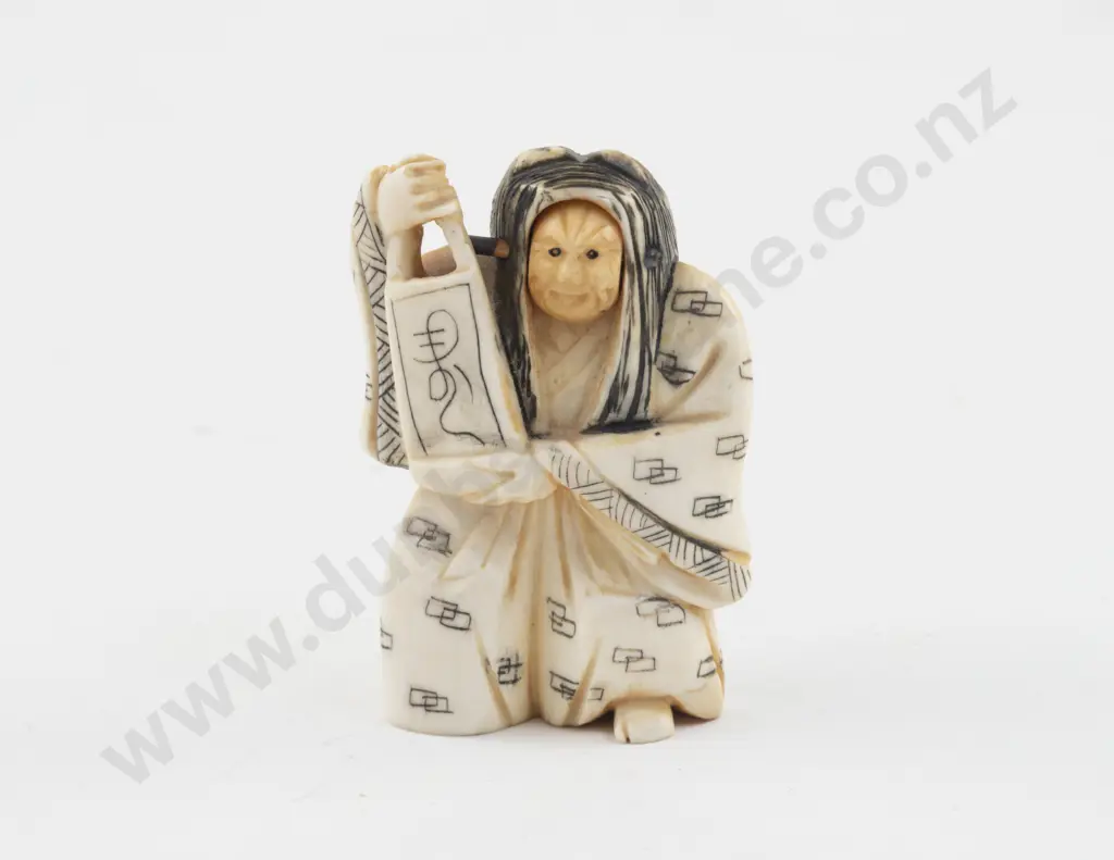 Carved Ivory Netsuke of a Noh Actor with Rolling Head Image 1++