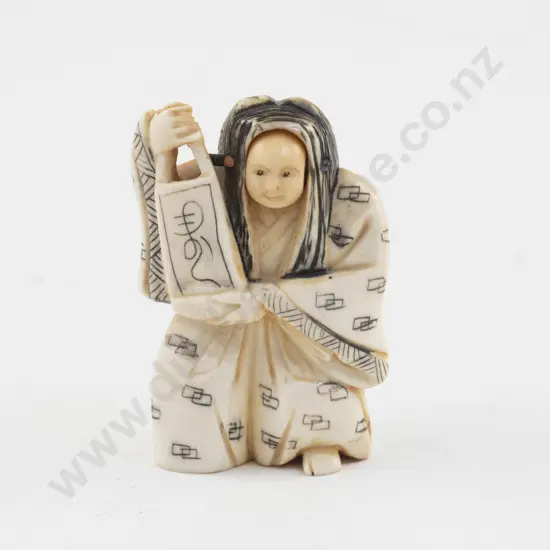 Carved Ivory Netsuke of a Noh Actor with Rolling Head