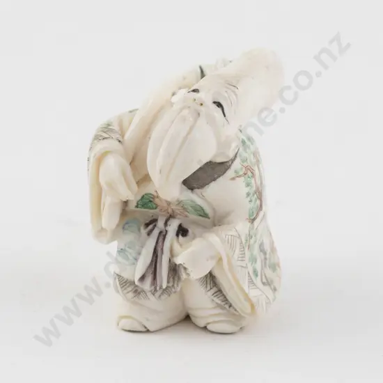 Signed and Stained Ivory Netsuke of an Immortal with Very Elongated Head