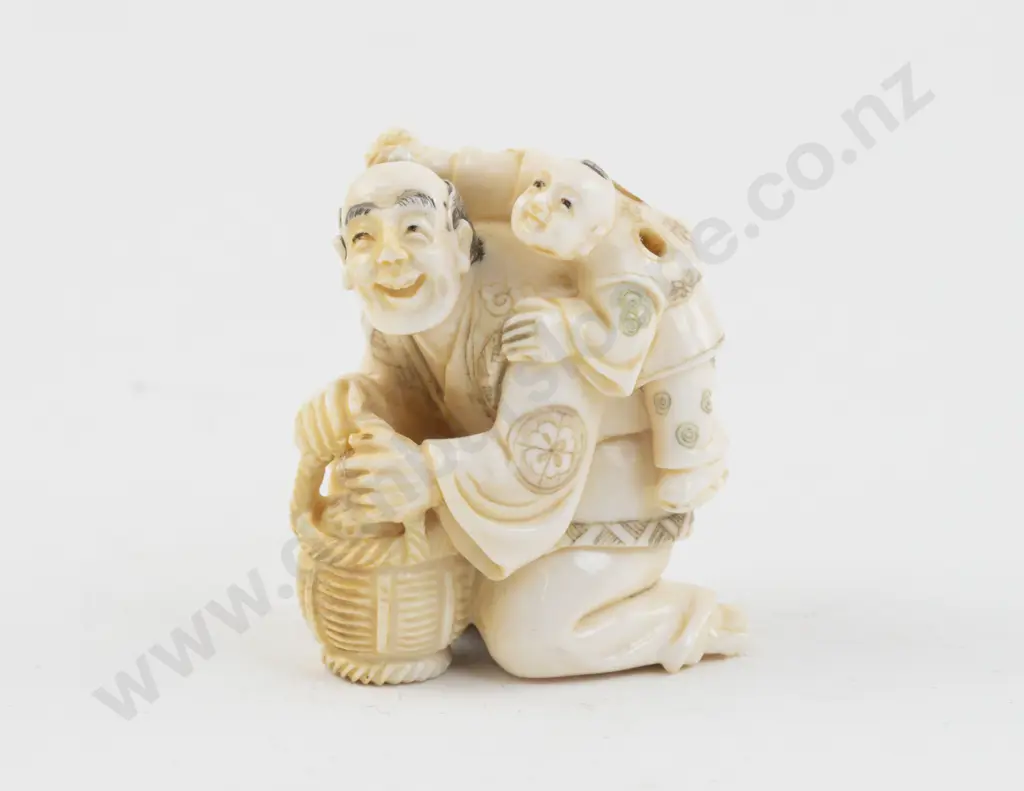 Signed Ivory Netsuke of a Vendor with Child on His Back Image 1++