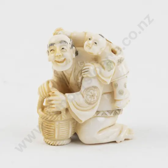 Signed Ivory Netsuke of a Vendor with Child on His Back